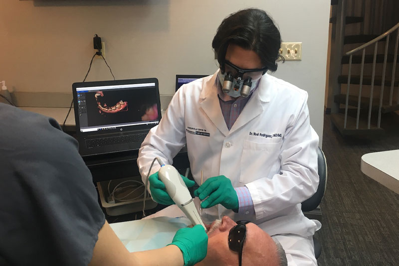 dr rodriguez performing dental procedure