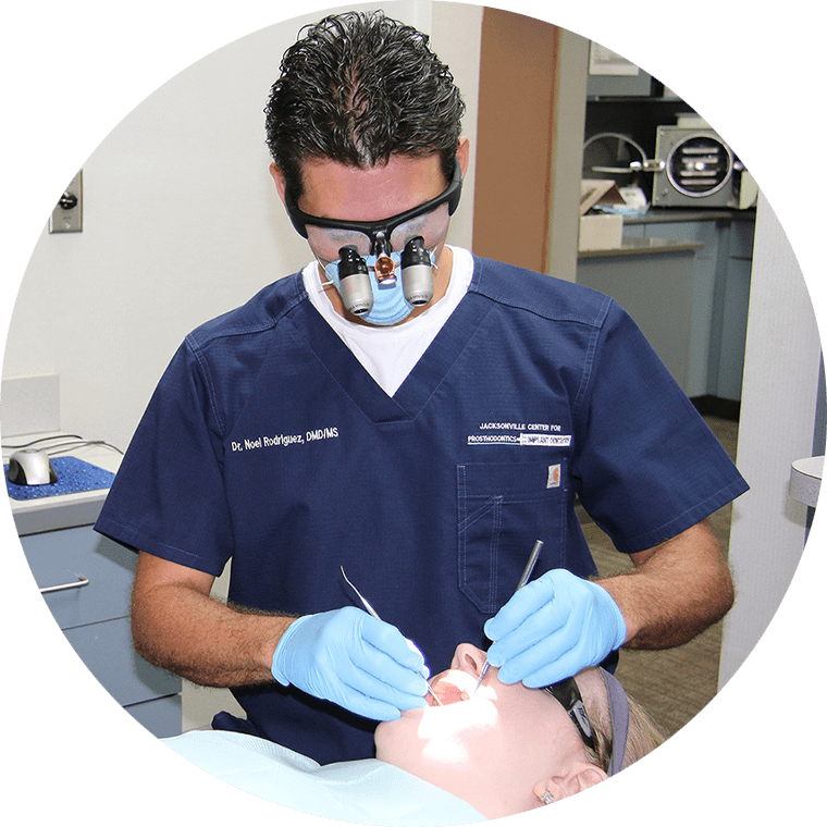 dr rodriguez performing dental procedure