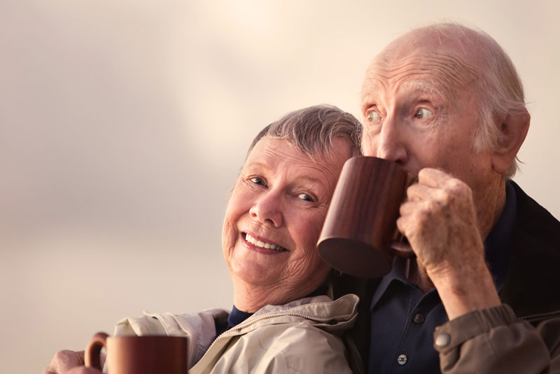 Dental Implant Patients Smiling And Drinking Coffee