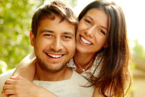 Dental Patients Smiling With Well Cared For Dental Implants In Jacksonville, FL