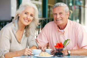 Dental Implant Patients Eating Together With Their False Teeth in Jacksonville, FL