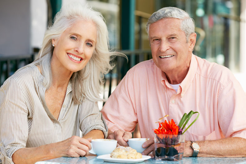 Dental Implant Patients Eating Together With Their False Teeth in Jacksonville, FL