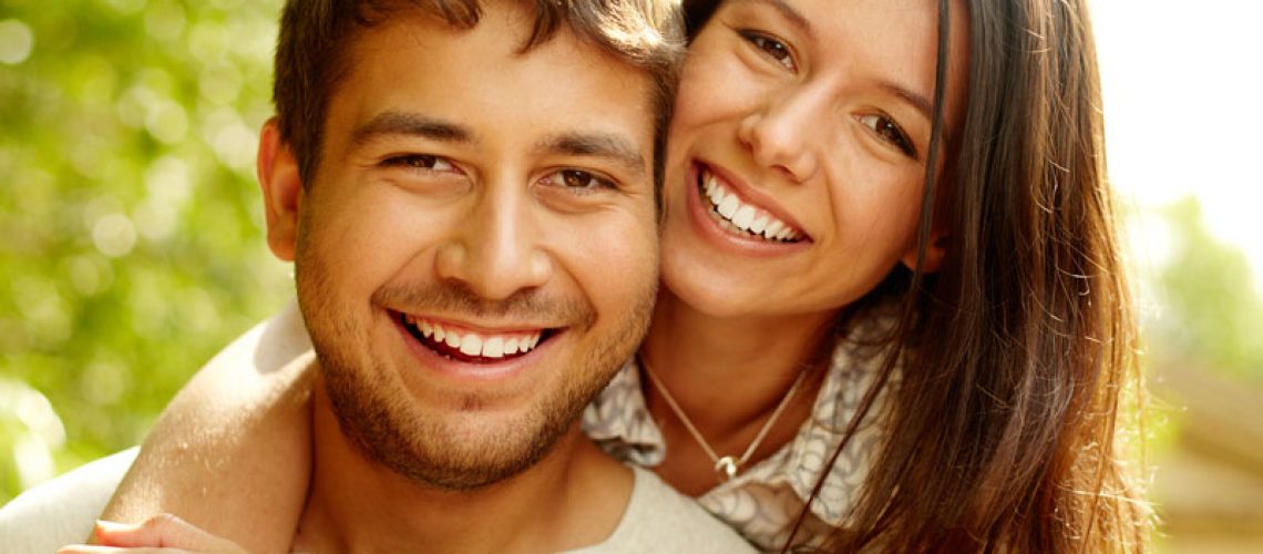 Dental Patients Smiling With Well Cared For Dental Implants In Jacksonville, FL